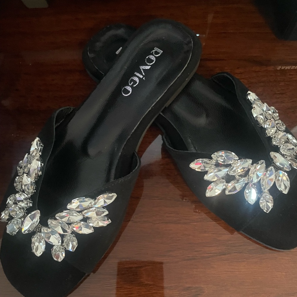 Black sandals with crystal embellishment.
